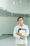 Man standing, smiling at camera, portrait