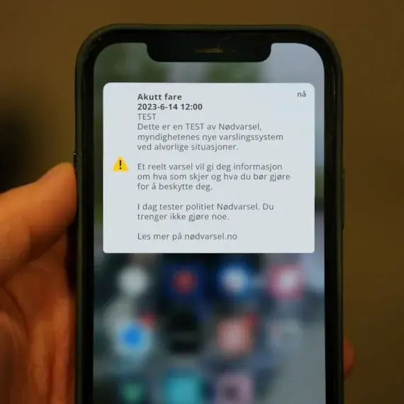 En mobilskjerm med eksempel på hvordan meldingen med varsel vil se ut