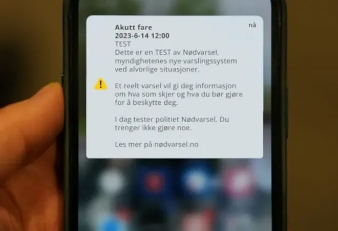 En mobilskjerm med eksempel på hvordan meldingen med varsel vil se ut
