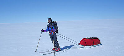 man pulling sledge